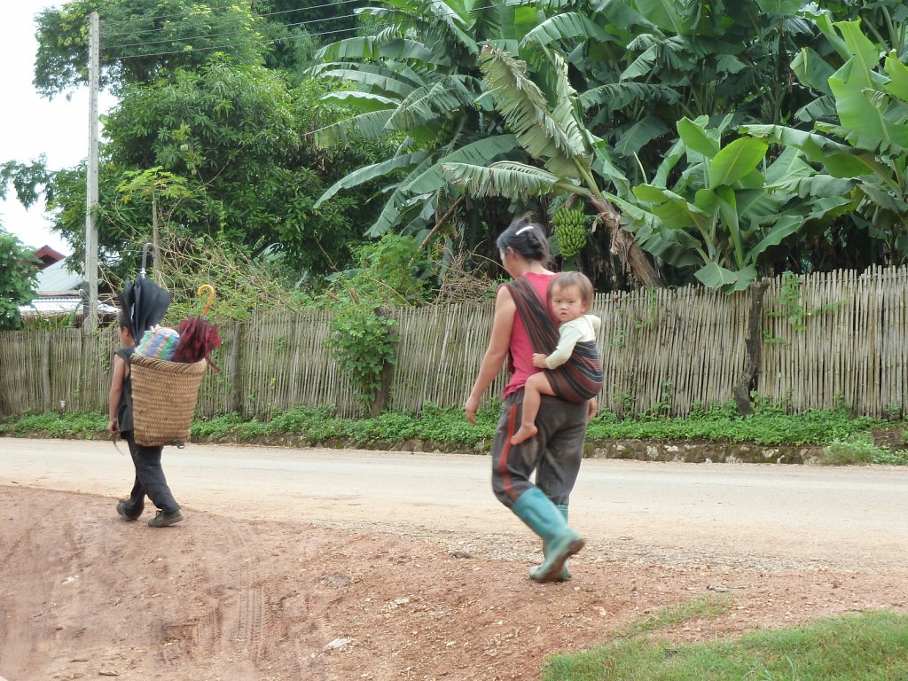 Woman with her baby on the way to work