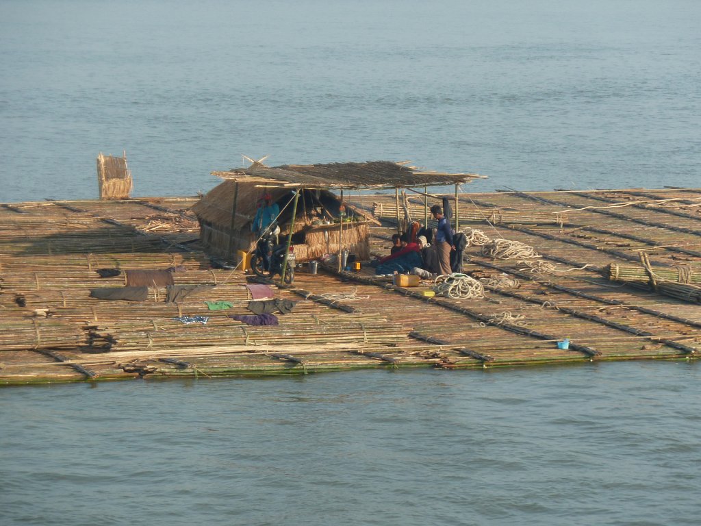 Crew and their hut on a wood raft